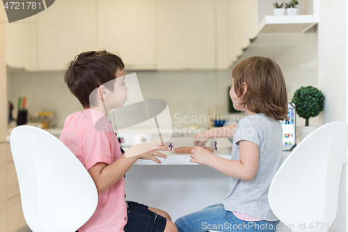 Image of cute little brother and sister at home