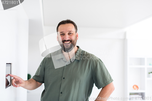 Image of smart home and technology concept close up of male hands