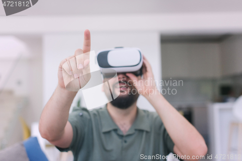 Image of man with beard trying vr glasses