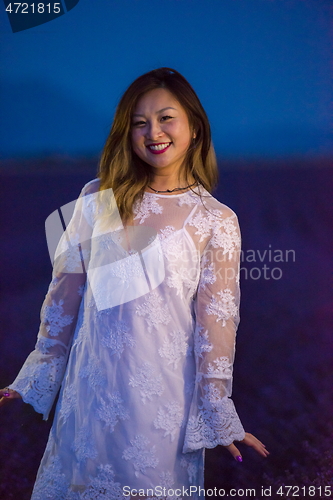 Image of portrait of and asian woman in lavender flower field