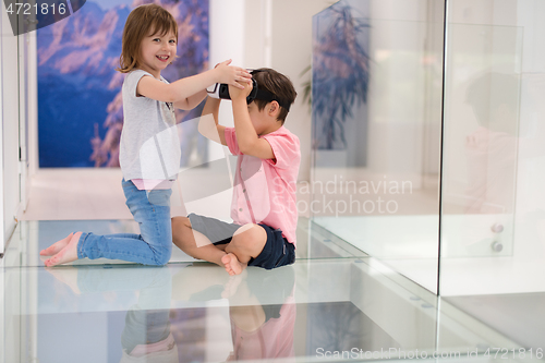 Image of kids using virtual reality headsets at home