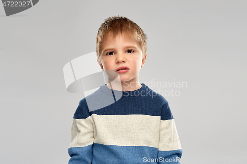 Image of portrait of little boy in striped pullover