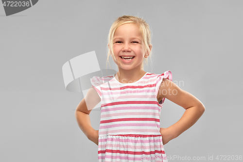 Image of smiling little girl in striped dress