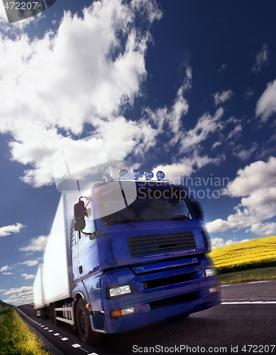 Image of truck driving at dusk/motion blur