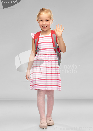 Image of happy student girl with school bag waving hand