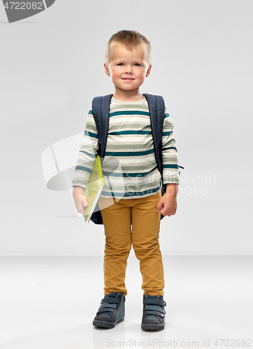 Image of portrait of smiling boy with school backpack