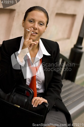 Image of businesswoman with sigarette
