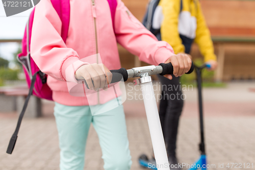 Image of close up of school children with scooters