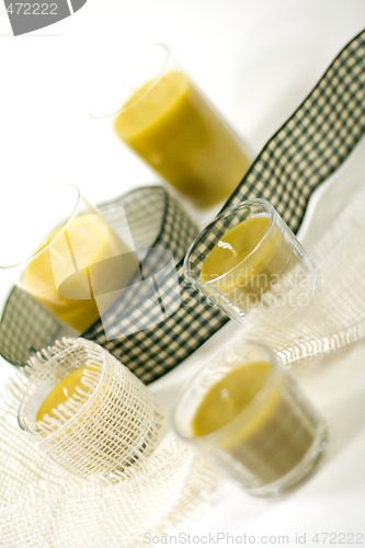 Image of candles and green ribbon