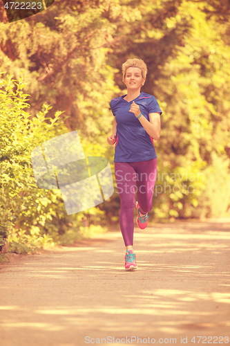 Image of young female runner training for marathon