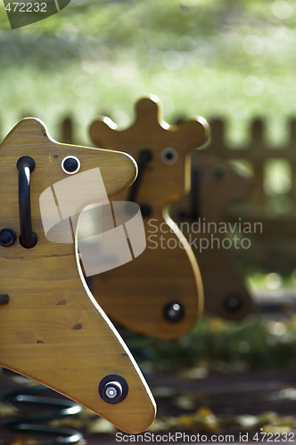 Image of Horse still swing detail in a playground