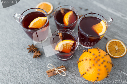 Image of glasses of mulled wine with orange and cinnamon