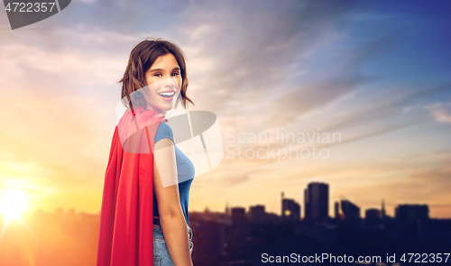 Image of happy woman in superhero cape over tallinn city