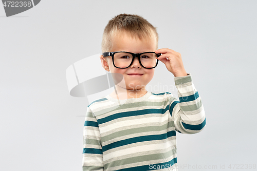 Image of portrait of smiling boy in glasses