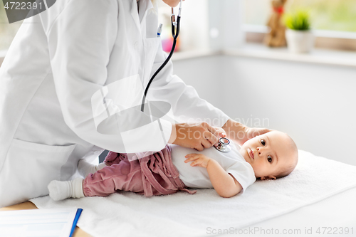 Image of doctor with stethoscope listening to baby patient