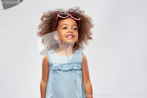 Image of little african girl in heart shaped sunglasses