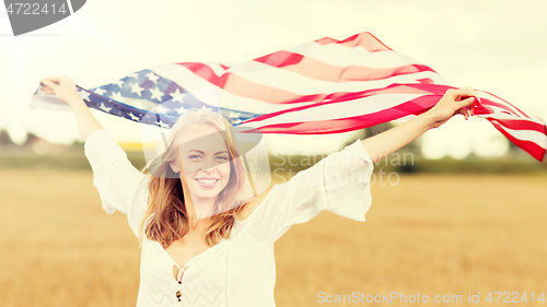 Image of happy woman with american flag on cereal field