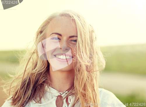 Image of close up of happy young woman in white outdoors