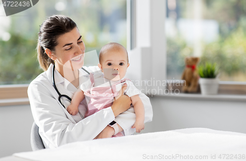 Image of female pediatrician doctor with baby at clinic