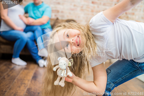 Image of little girl fooling around in front of the camera