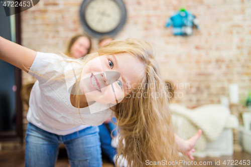 Image of little girl fooling around in front of the camera