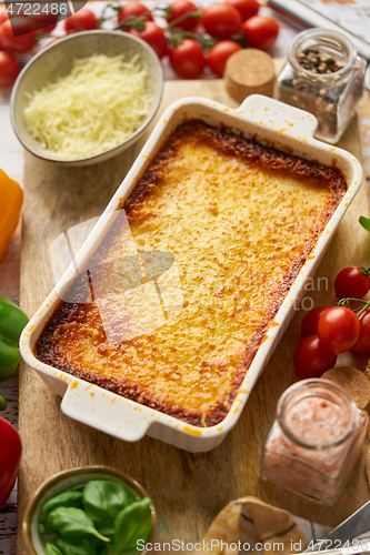 Image of Tasty traditional italian lasagna with bolognese, melted and cheese. Served with ingredients