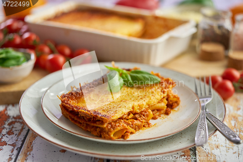 Image of Delicious lasagne bolognese with pepper, tomato and cheese