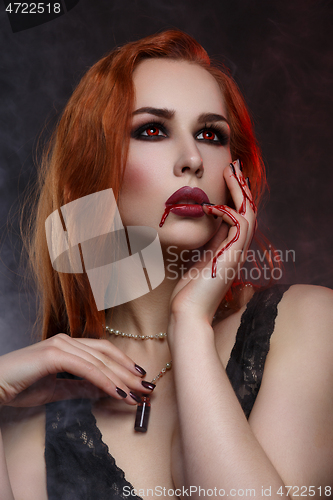 Image of Beautiful vampire young woman