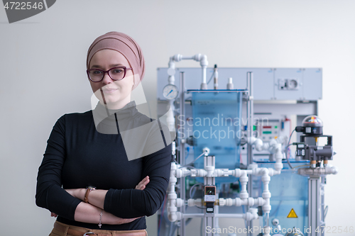 Image of portrait of muslim female student in the electronic classroom