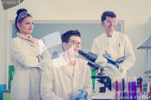 Image of Group of young medical students doing research