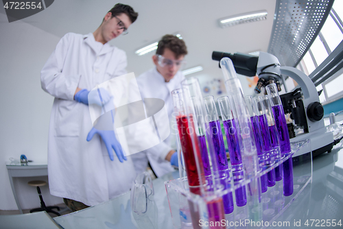 Image of Group of young medical students doing research