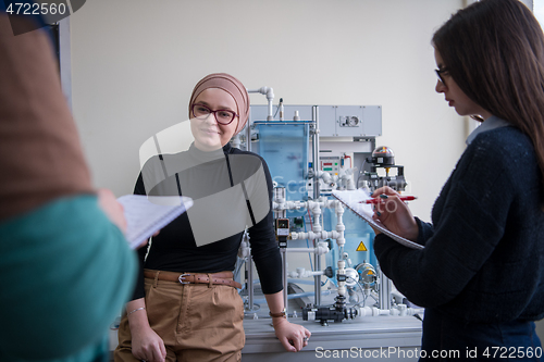 Image of young students doing practice in the electronic classroom