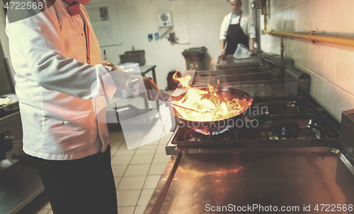 Image of Chef doing flambe on food