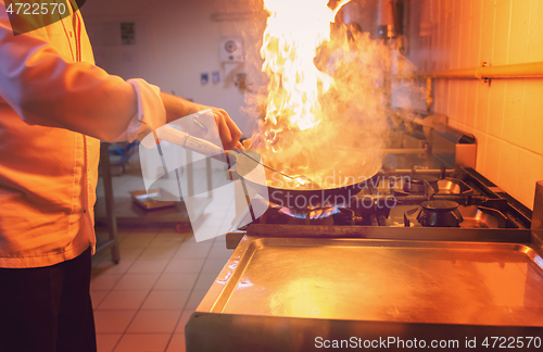 Image of Chef doing flambe on food