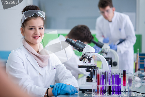 Image of Group of young medical students doing research