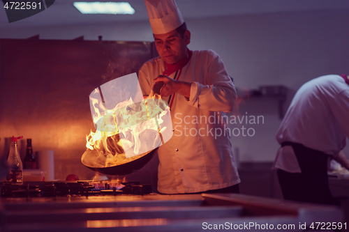 Image of Chef doing flambe on food