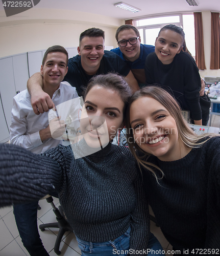 Image of young happy students doing selfie picture