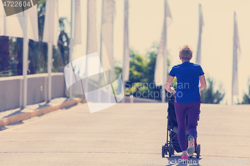 Image of mom with baby stroller jogging