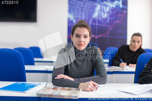 Image of female student writing notes