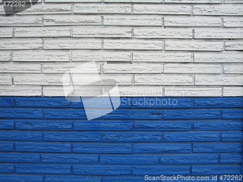Image of white and blue brick building