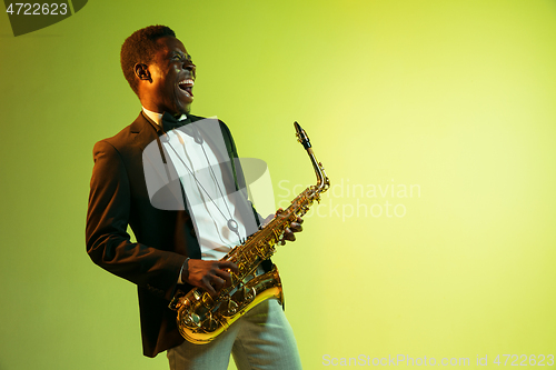 Image of Young african-american jazz musician playing the saxophone