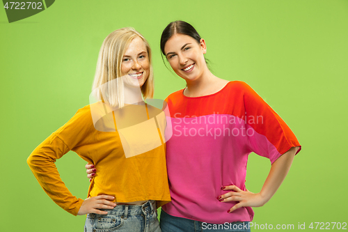 Image of Portrait of pretty girls isolated on green studio background