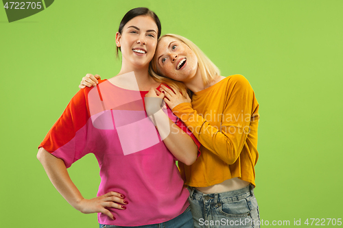 Image of Portrait of pretty girls isolated on green studio background