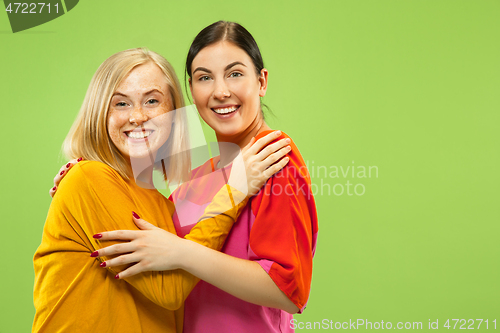 Image of Portrait of pretty girls isolated on green studio background