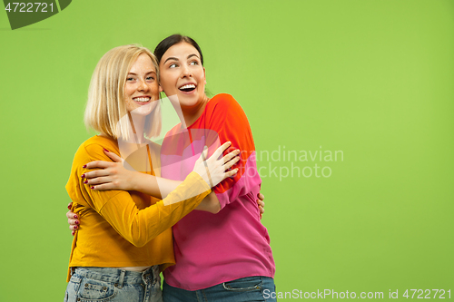 Image of Portrait of pretty girls isolated on green studio background