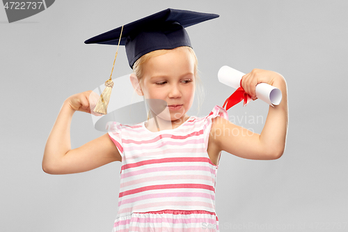 Image of little girl in mortarboard with diploma