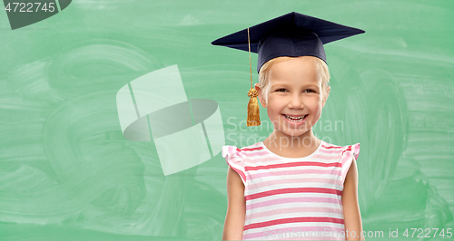 Image of happy school girl in bachelor hat or mortarboard