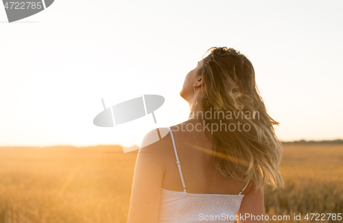 Image of woman on cereal field in summer