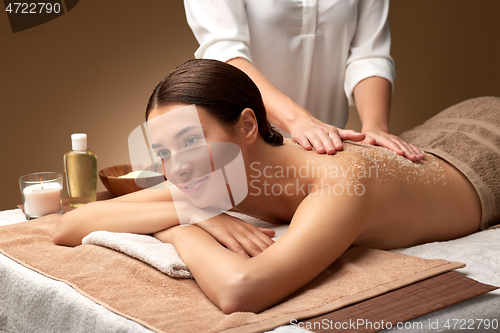 Image of close up of woman lying and having massage in spa