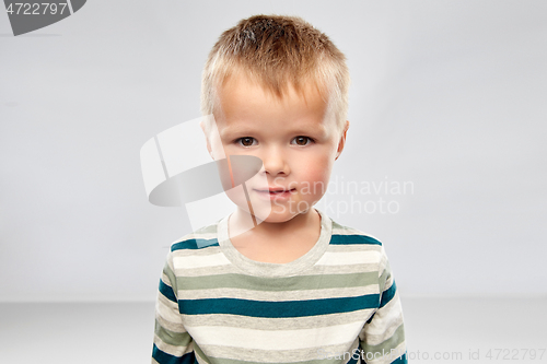 Image of portrait of little boy in striped shirt